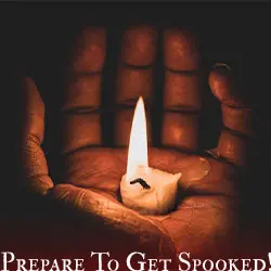 A hand with a candle lurks in the darkness
