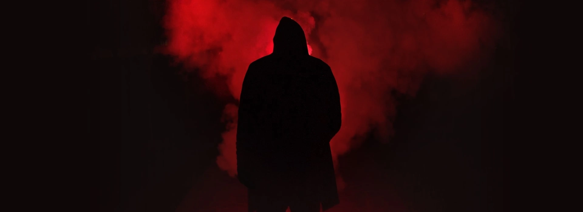 A mysterious stranger waits among the fog.